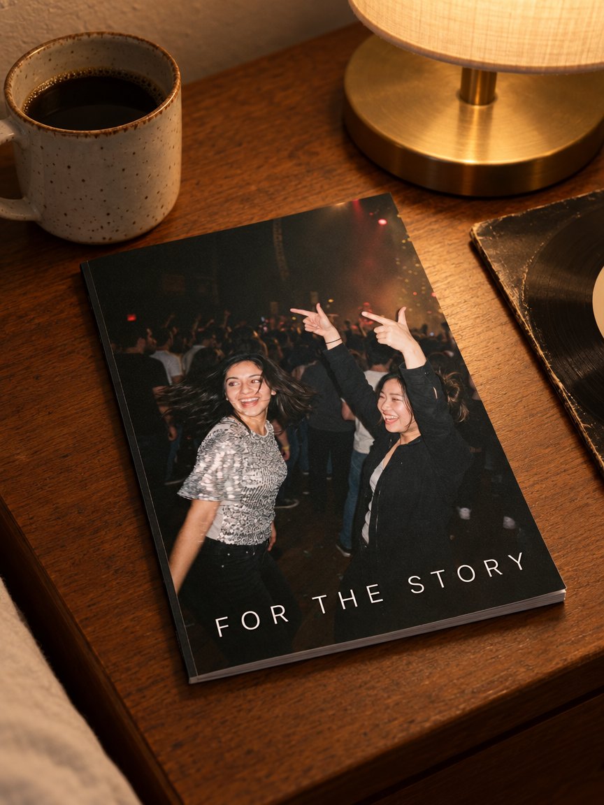 The printed zine on a bedside table with coffee and a record, spine toward you